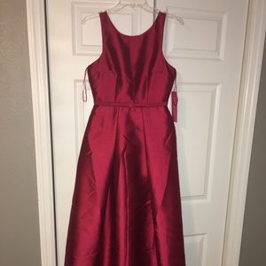 Burgundy gown.